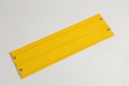 150Х500Х6мм Тактильная плитка ТПУ, цвет желтый. «Прямые паралельные рифы с плоской вершиной» с клеевой основой с люверсами